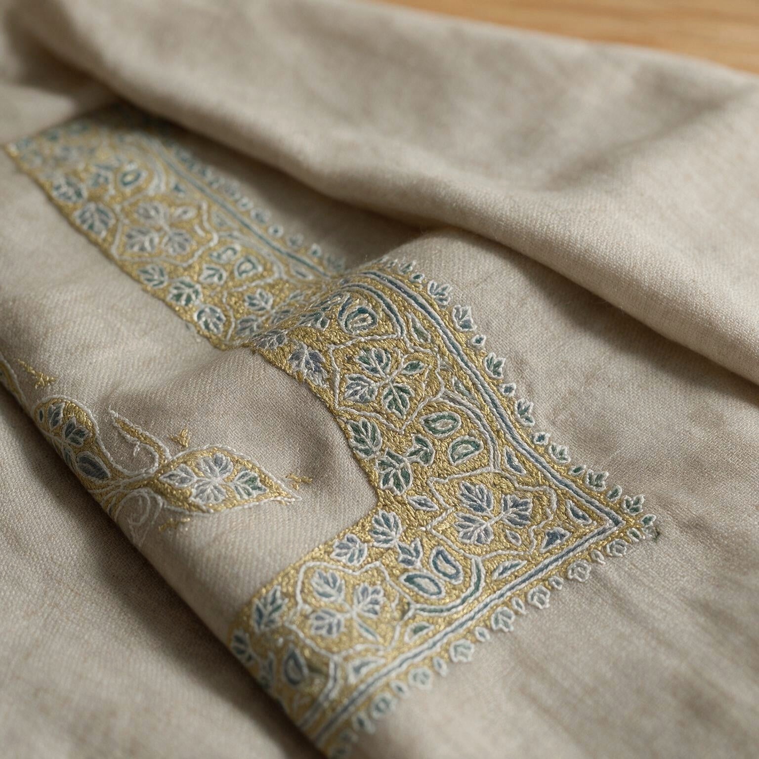 Dhabab Kashmiri pashmina ghutra in natural ecru with pale blue and gold paisley sozni embroidery