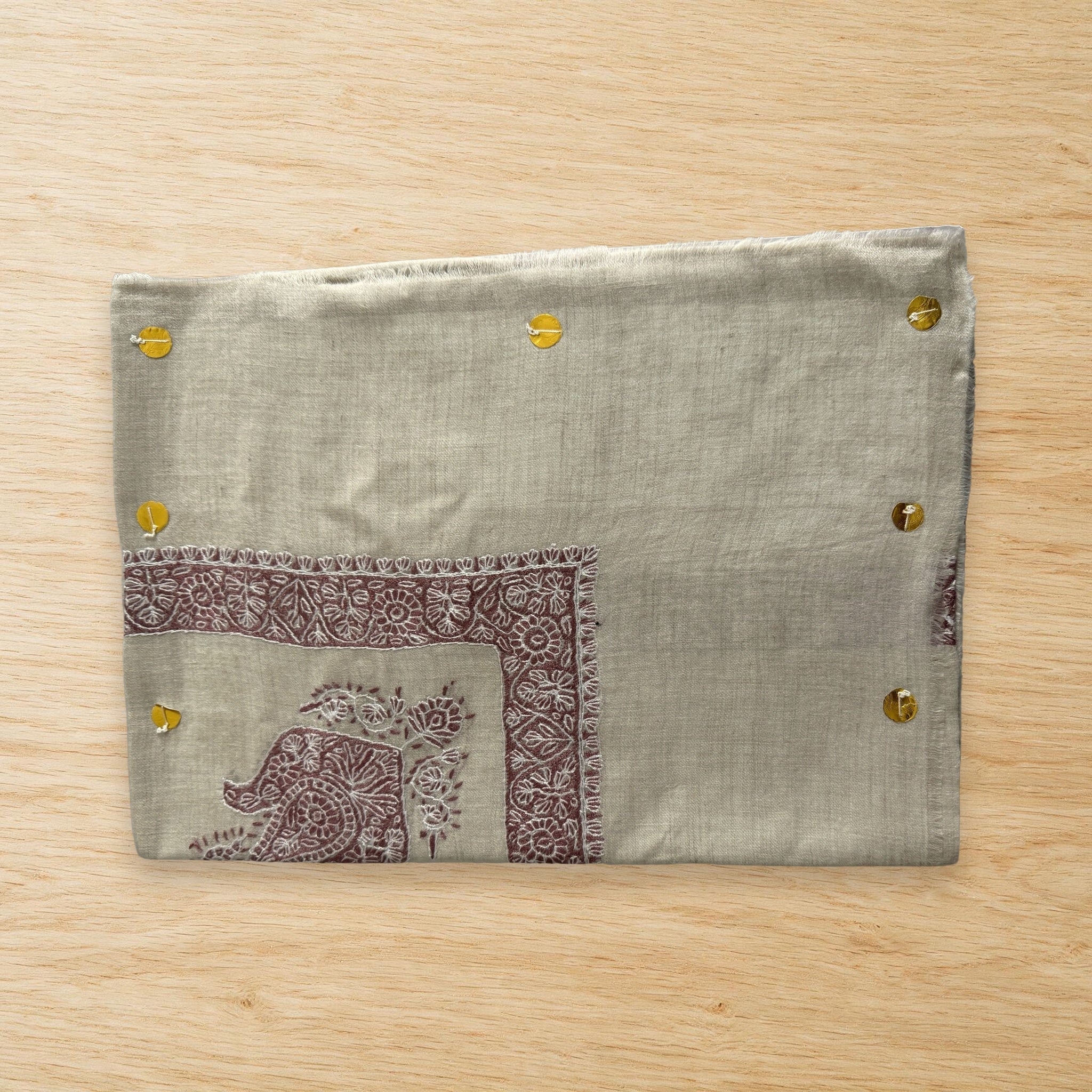 Sabah Kashmiri pashmina ghutra laid flat on a wooden table, true to life colour