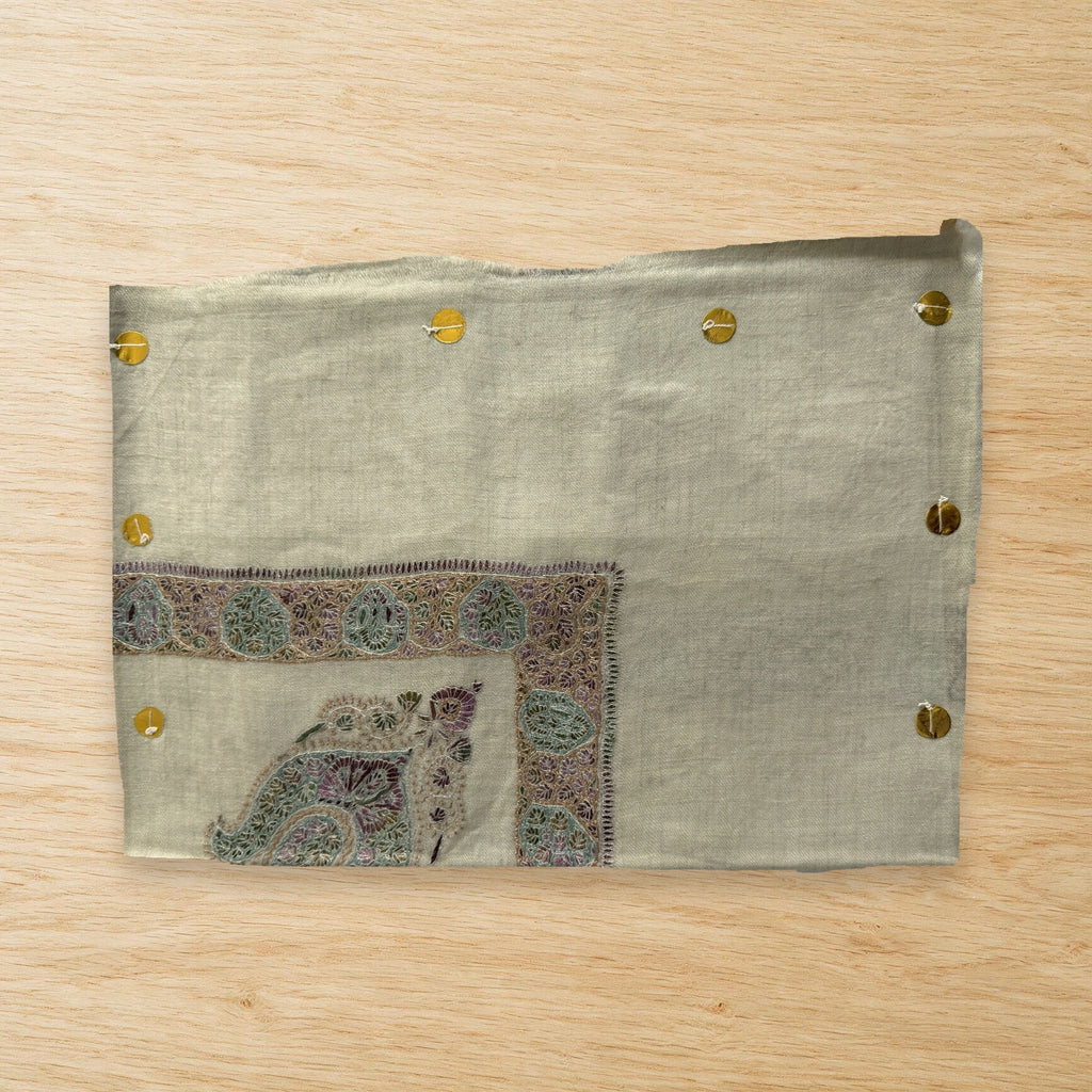 Banafsha Kashmiri pashmina ghutra laid flat on a wooden table, true to life colour