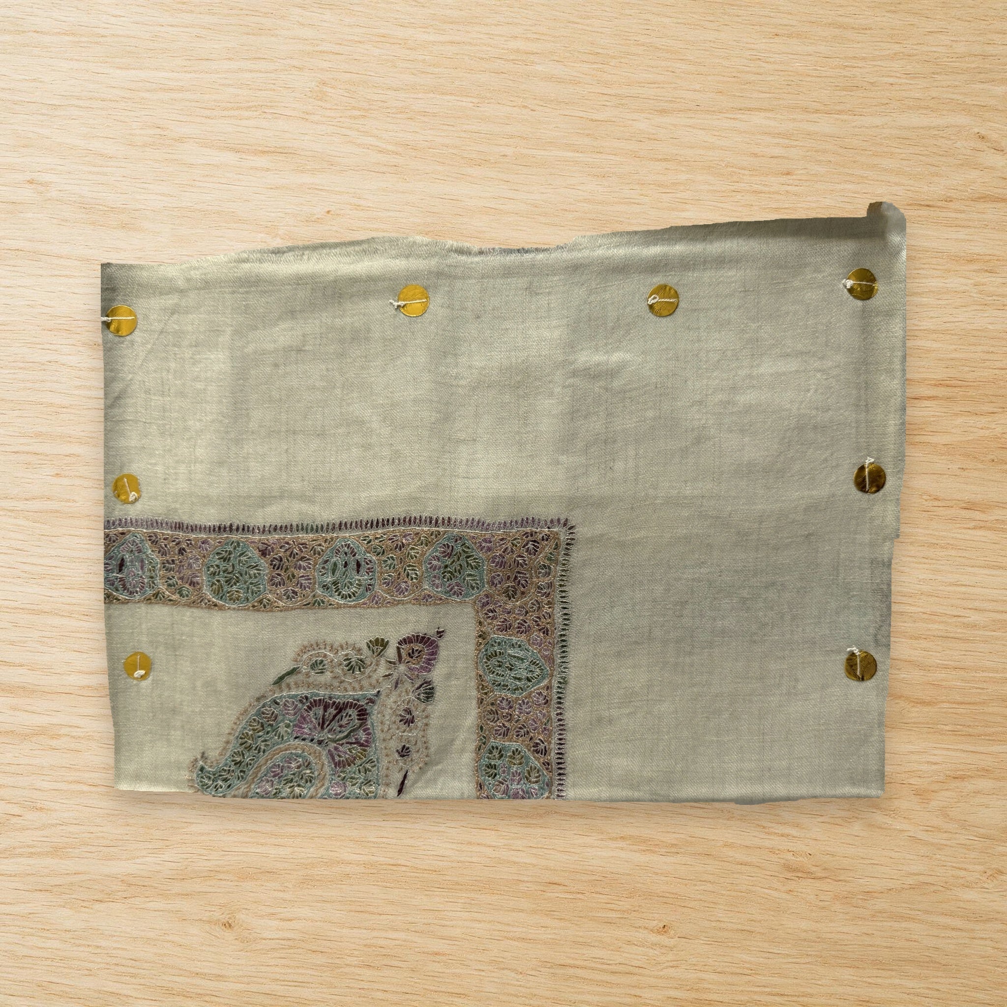Banafsha Kashmiri pashmina ghutra laid flat on a wooden table, true to life colour