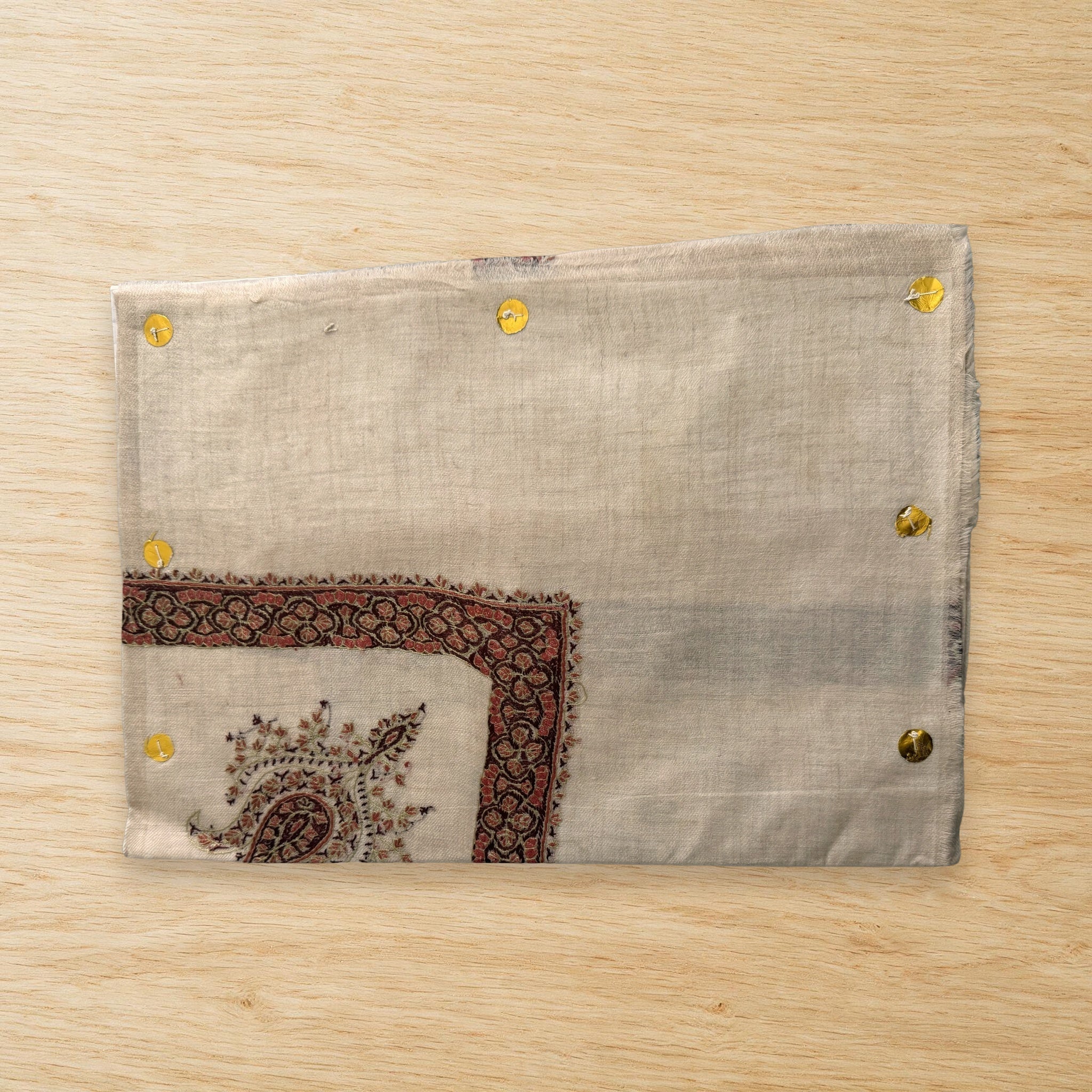 Marjan Kashmiri pashmina ghutra laid flat on a wooden table, true to life colour
