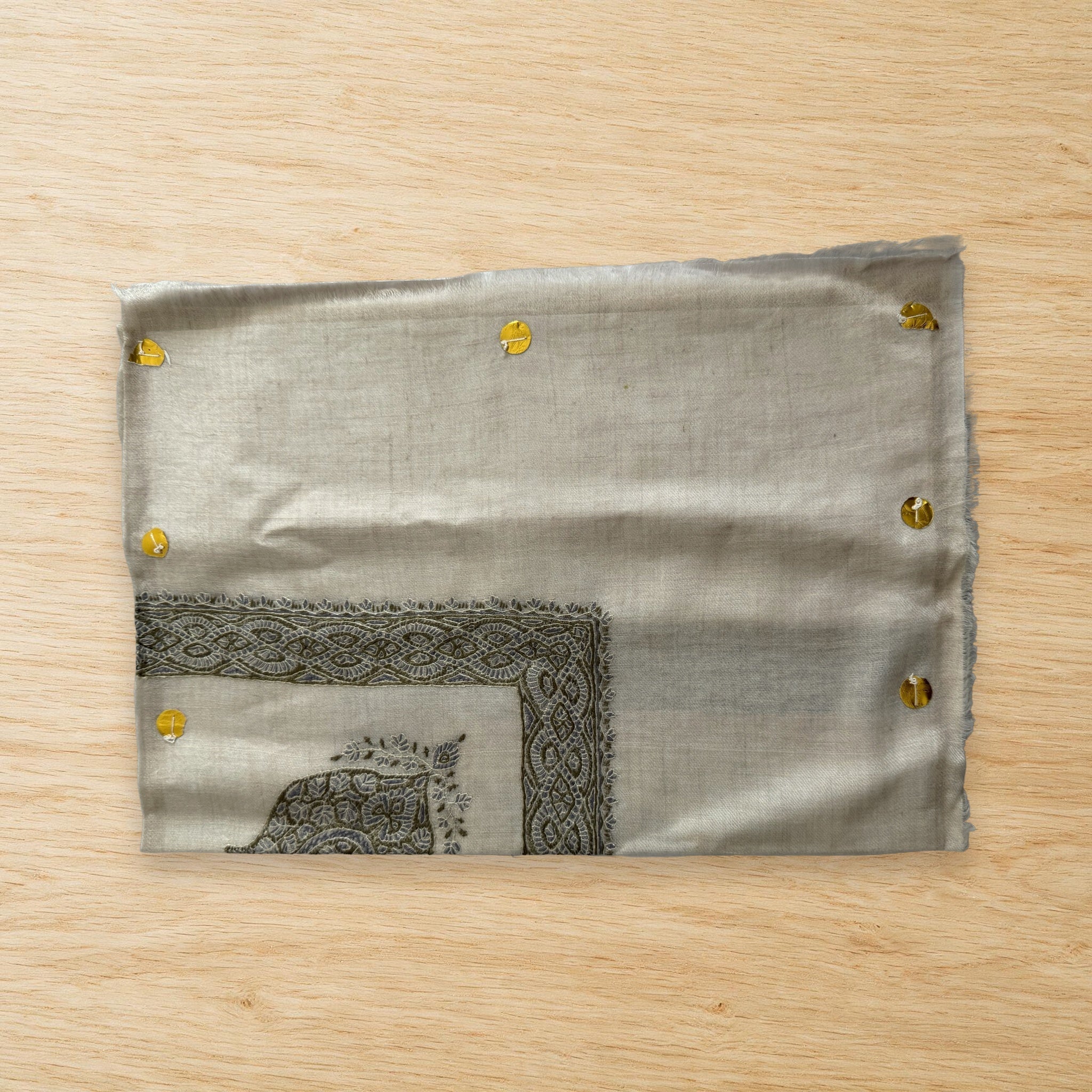 Hajar Kashmiri pashmina ghutra laid flat on a wooden table, true to life colour