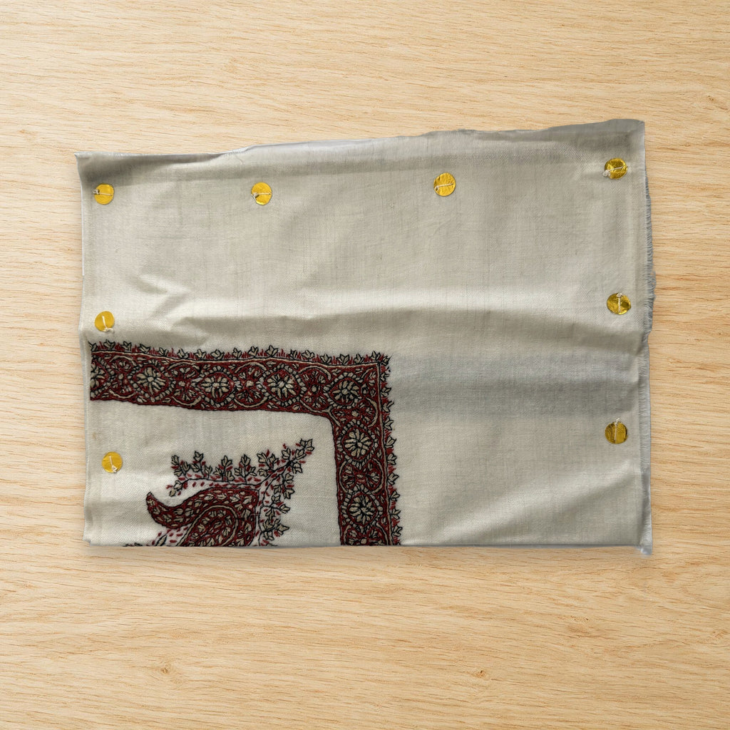 Shafaq Kashmiri pashmina ghutra laid flat on a wooden table, true to life colour