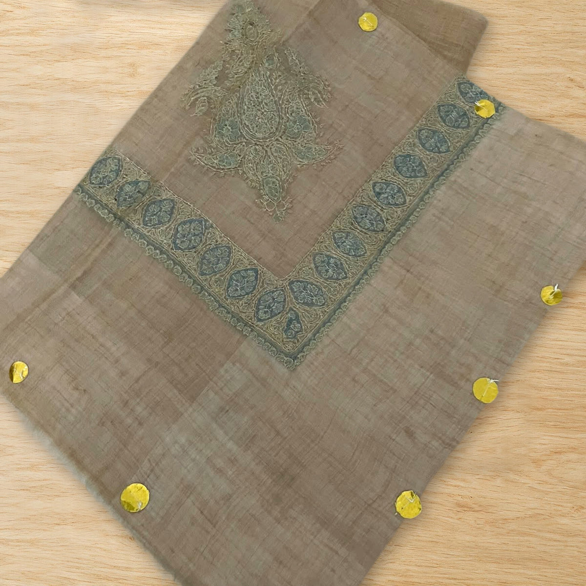 Zabarjad Kashmiri pashmina ghutra folded on a wooden table, true to life colour