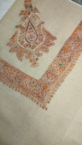 Nafud Kashmiri pashmina ghutra, oatmeal base with a soft apricot and terracotta corner motif and paisley border