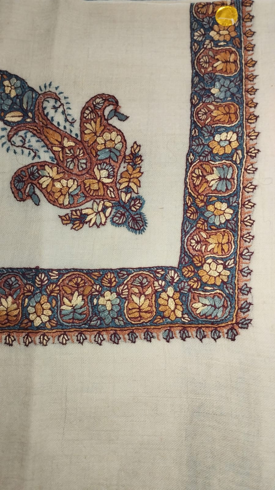 Wasma Kashmiri pashmina ghutra, oatmeal base with an indigo and rust corner motif and an indigo border of amber flowers