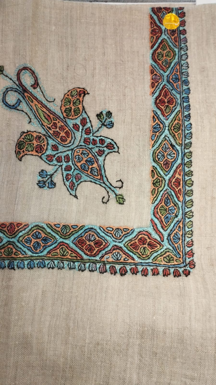 Zellij Kashmiri pashmina ghutra, oatmeal base with a turquoise, red and amber corner motif and lozenge border, outlined in black