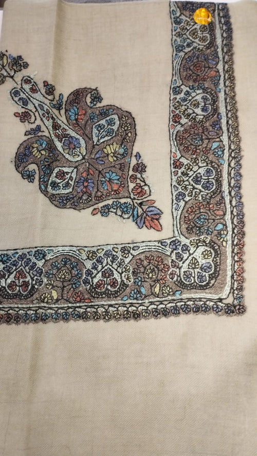 Abanus Kashmiri pashmina ghutra, oatmeal base with a dark brown and ivory corner motif and border, scattered with pastel blue, rose and saffron flowers