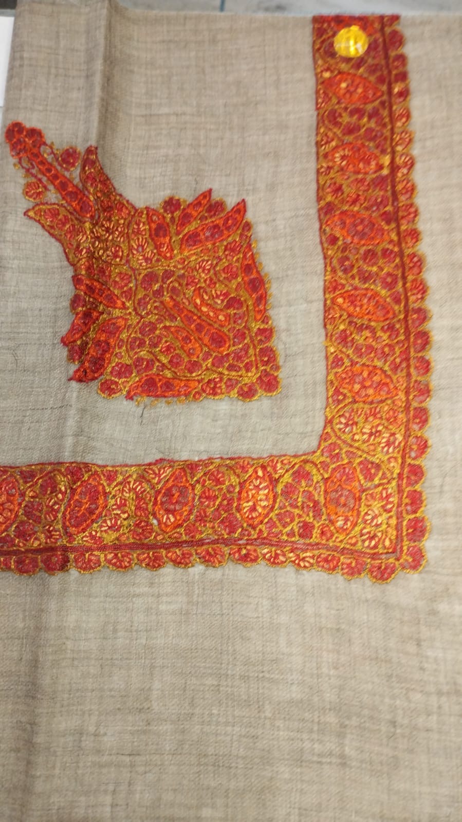 Shula Kashmiri pashmina ghutra, oatmeal base with a flame orange and scarlet corner motif and paisley border