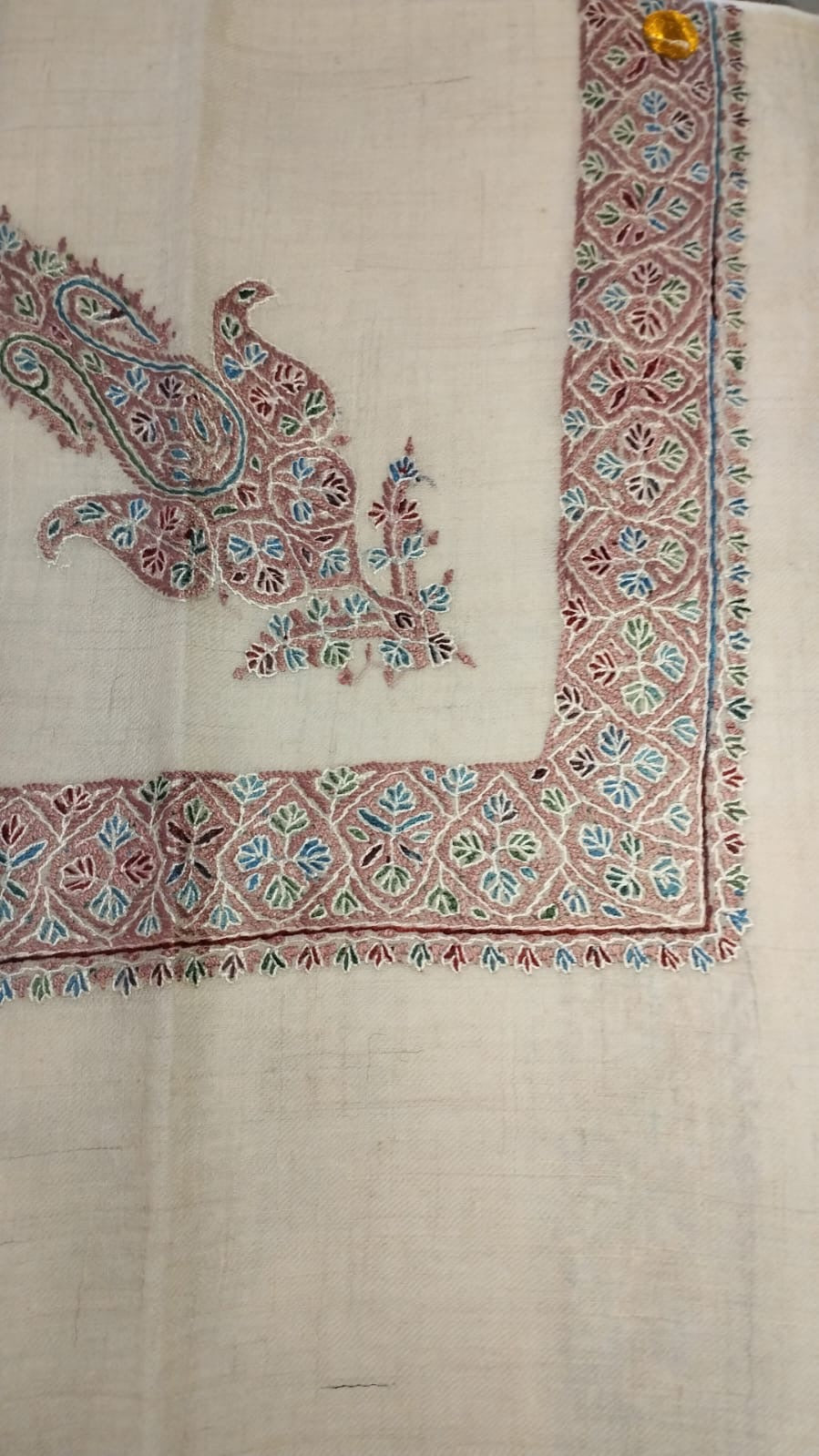Taifi Kashmiri pashmina ghutra, oatmeal base with a dusty rose corner motif and lattice border, with sky blue and green leaves