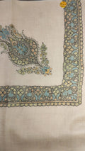 Waha Kashmiri pashmina ghutra, oatmeal base with an aqua blue and olive green corner motif and border, outlined in black