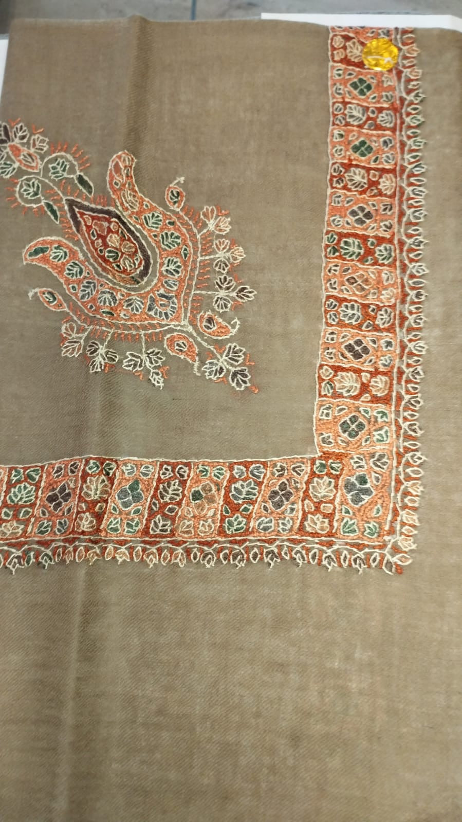 Kammun Kashmiri pashmina ghutra, khaki base with a coral and ivory corner motif and a tiled border in rust and coral