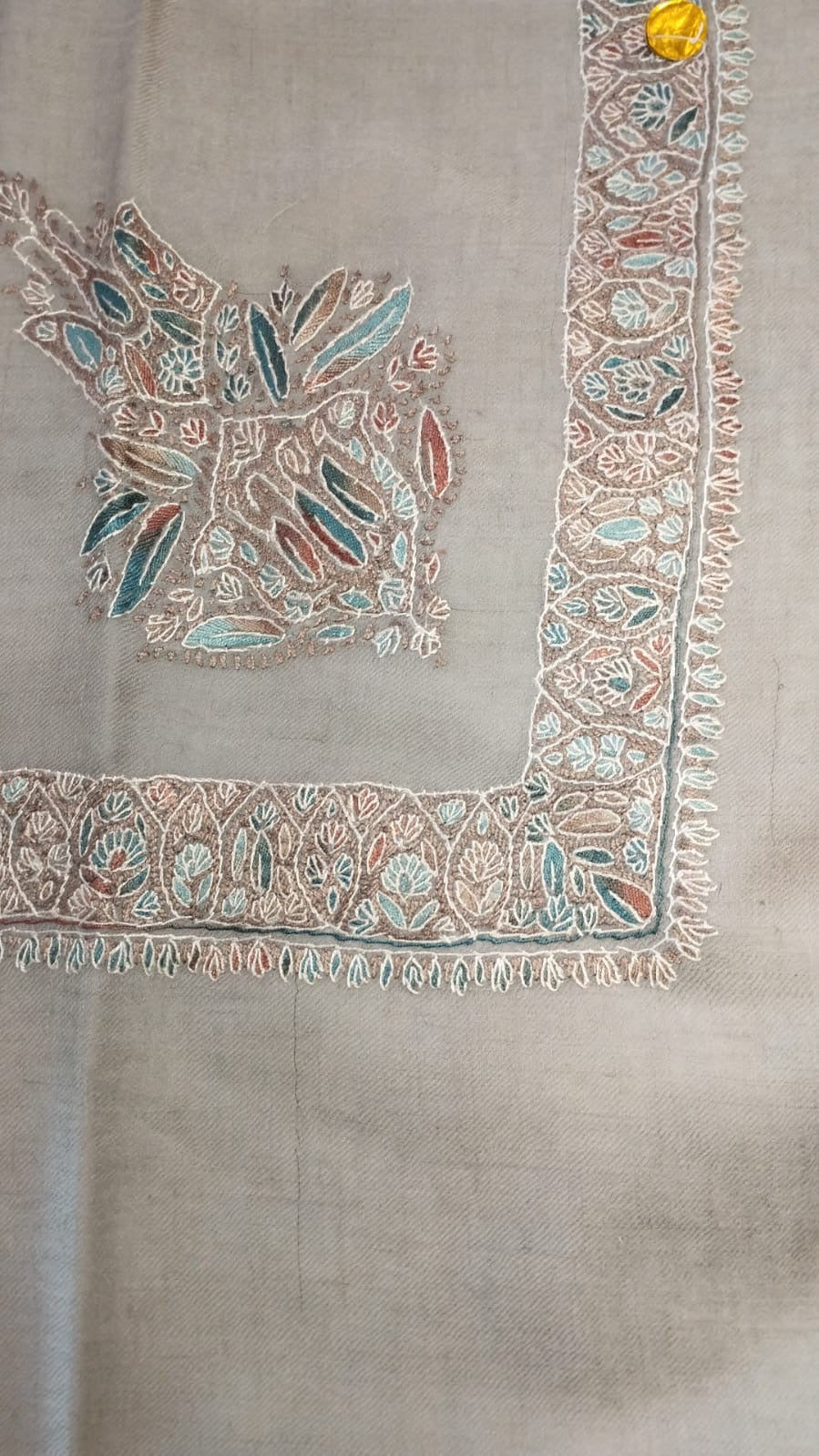 Hilal Kashmiri pashmina ghutra, stone grey base with an ivory corner motif and border, with teal and rust leaves