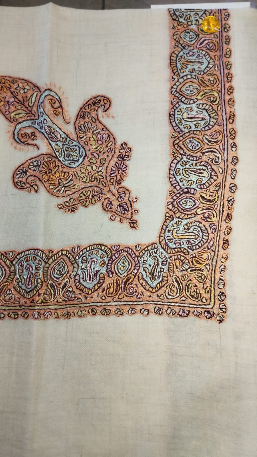 Shamam Kashmiri pashmina ghutra, oatmeal base with a peach and pale blue corner motif and paisley border