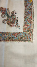 Karm Kashmiri pashmina ghutra, cream base with a rust red and sky blue corner motif and a scrolling vine border