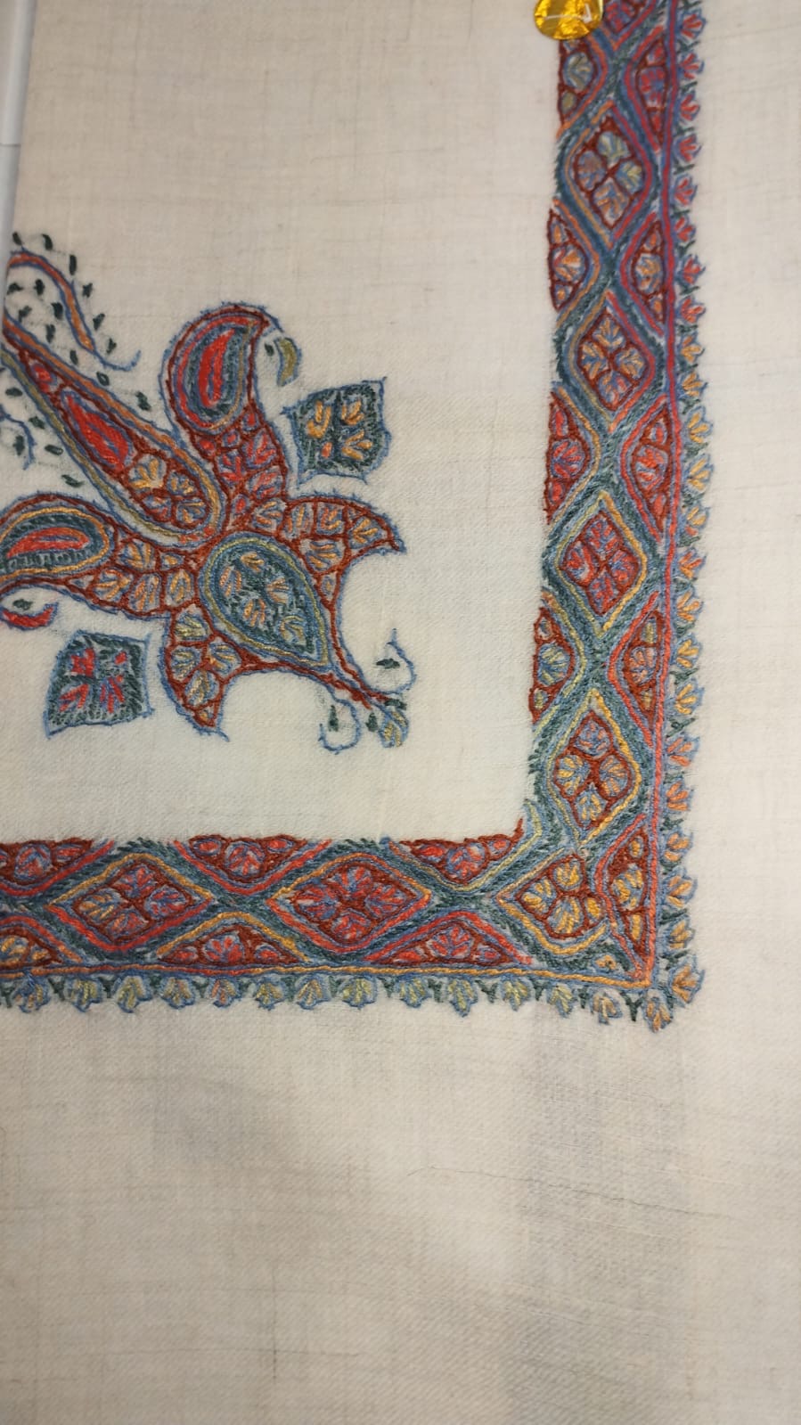 Bayraq Kashmiri pashmina ghutra, cream base with a red and steel blue corner motif and lozenge border