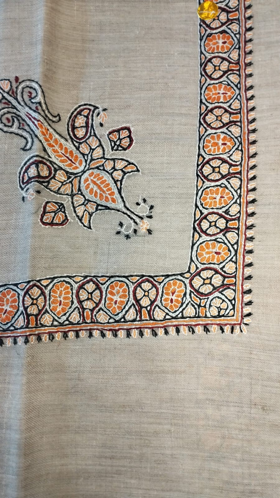Hudhud Kashmiri pashmina ghutra, oatmeal base with an apricot orange corner motif and border, outlined in black and ivory