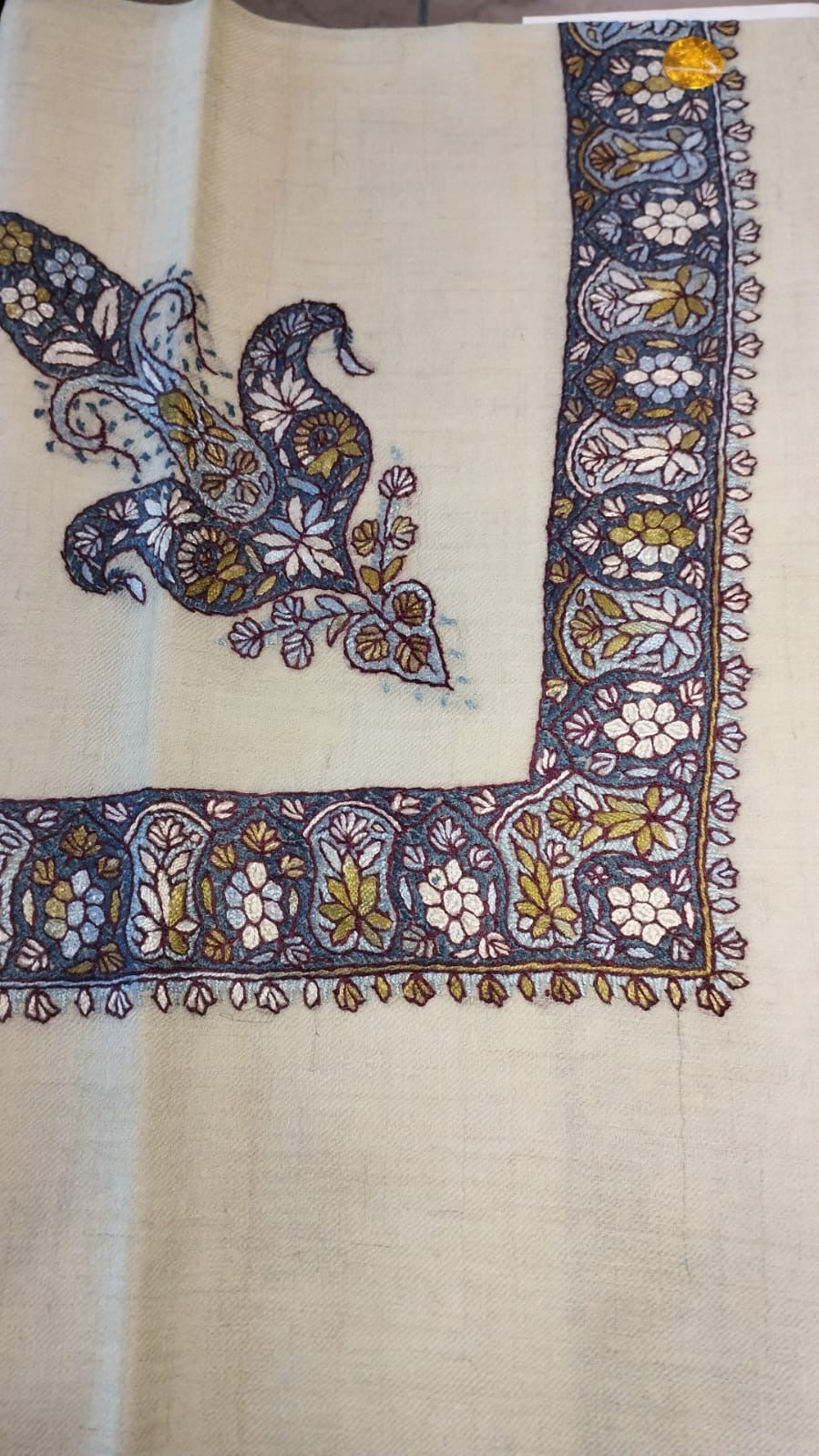 Uqhuwan Kashmiri pashmina ghutra, cream base with a navy corner motif and a navy border of ivory flowers and olive leaves