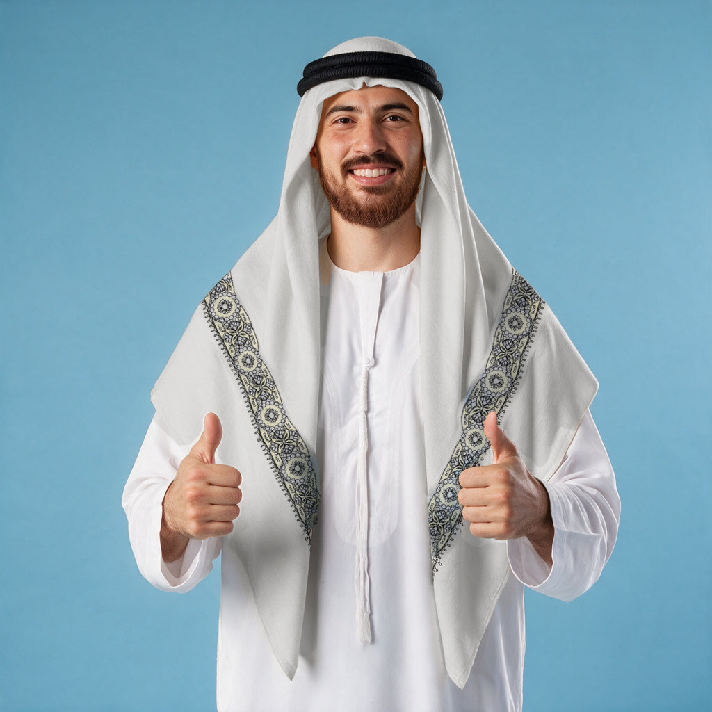 Man wearing the Kuhl Qalam Kaari Super Turma Kashmiri semi pashmina in soft natural white with a black agal and white thobe, fine black, cream and silver-grey pen-work border on each front end