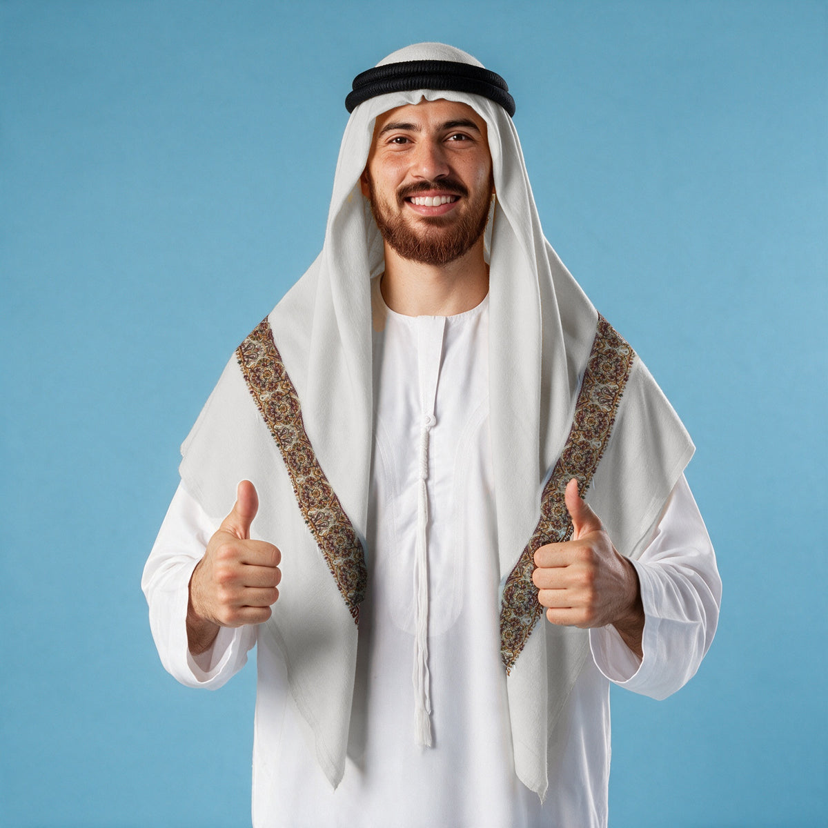 Man wearing the Asmar Qalam Kaari Super Turma Kashmiri semi pashmina in soft natural white with a black agal and white thobe, dense maroon, amber gold and olive multicolour pen-work border on each front end