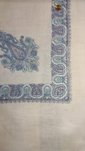 Andalib Qalam Kaari Pashmina laid flat, slate blue, dusty rose and sage paisley corner motif and winding paisley border on a natural oatmeal ground