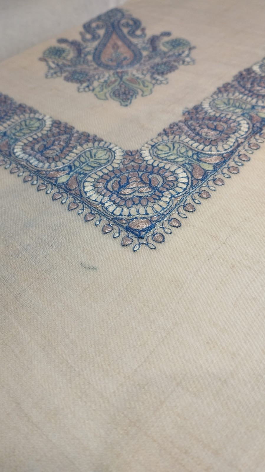 Close view of the Andalib Qalam Kaari Pashmina corner, slate blue, dusty rose and sage hand-drawn sozni