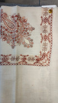 Hashiya Qalam Kaari Pashmina laid flat, brick red, rose and taupe floral bouquet corner motif and interlaced ribbon border on a natural oatmeal ground