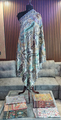Dibaj Kashmiri semi pashmina shawl draped on a mannequin, ivory and black paisley