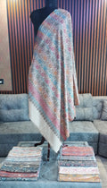 Firdaus Kashmiri semi pashmina shawl draped on a mannequin, ivory with roses