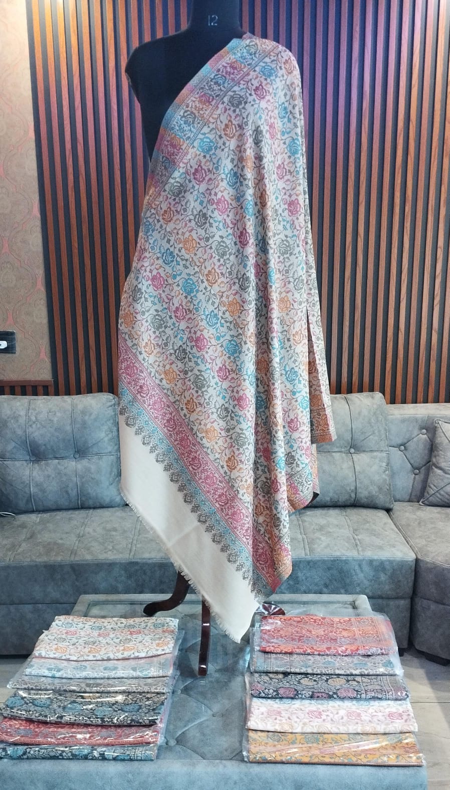 Firdaus Kashmiri semi pashmina shawl draped on a mannequin, ivory with roses