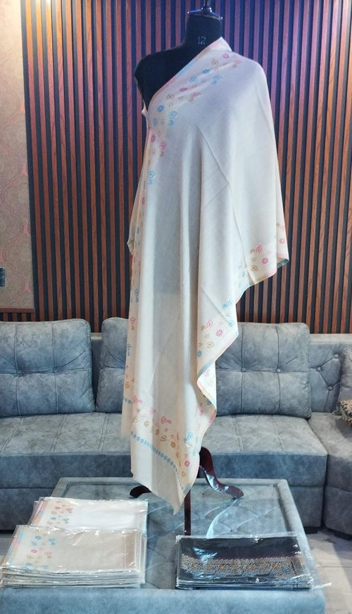 Safa Kashmiri semi pashmina stole draped on a mannequin, pale stone with pastel sprays