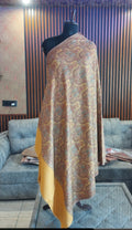 Shams Kashmiri semi pashmina shawl draped on a mannequin, saffron gold paisley