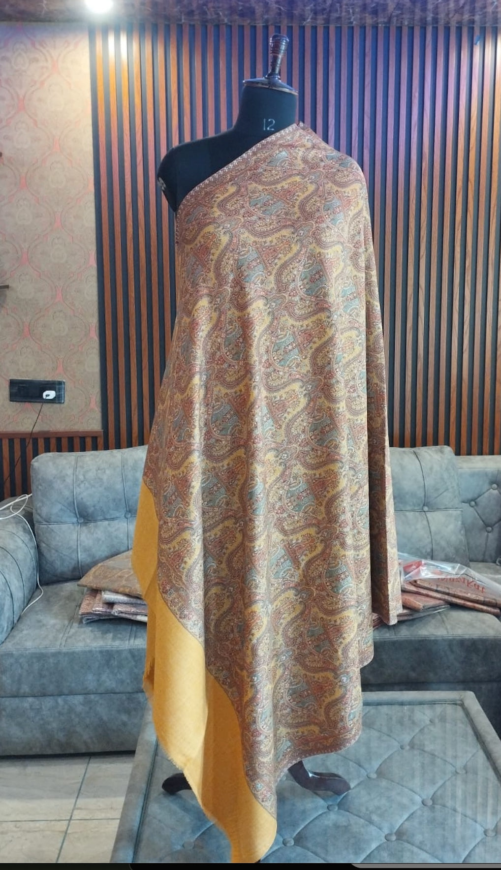 Shams Kashmiri semi pashmina shawl draped on a mannequin, saffron gold paisley