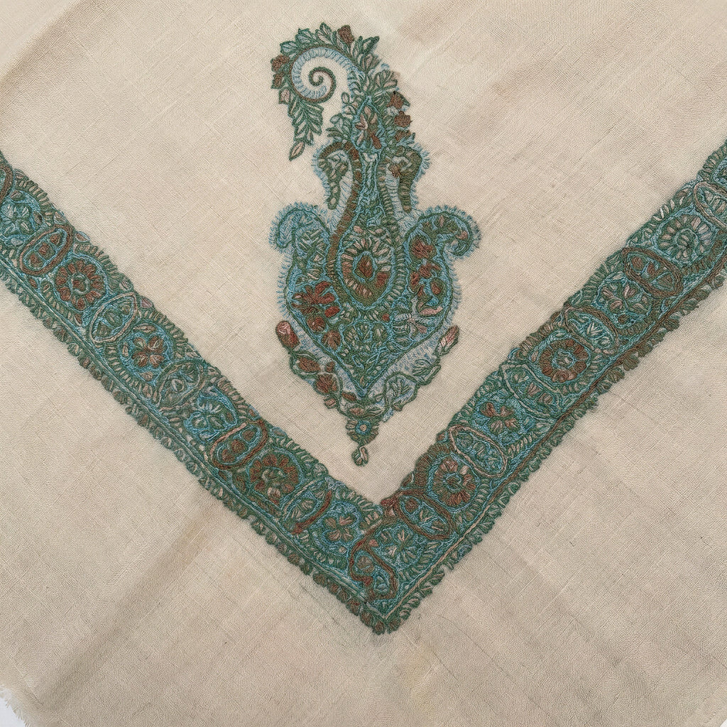Zumurrud Kashmiri pashmina ghutra with a teal paisley corner motif and a broad teal border of rust rosettes